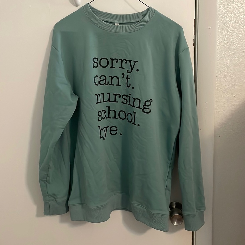 Sweat shirt size large nursing school.